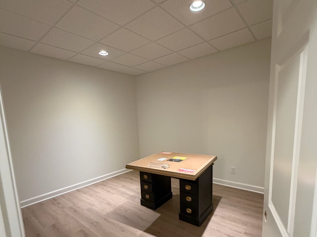 Finished basement room with new drywall and trim